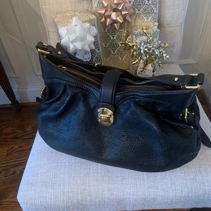 Beautiful black classic Louie Vuitton Mahina Hobo.
